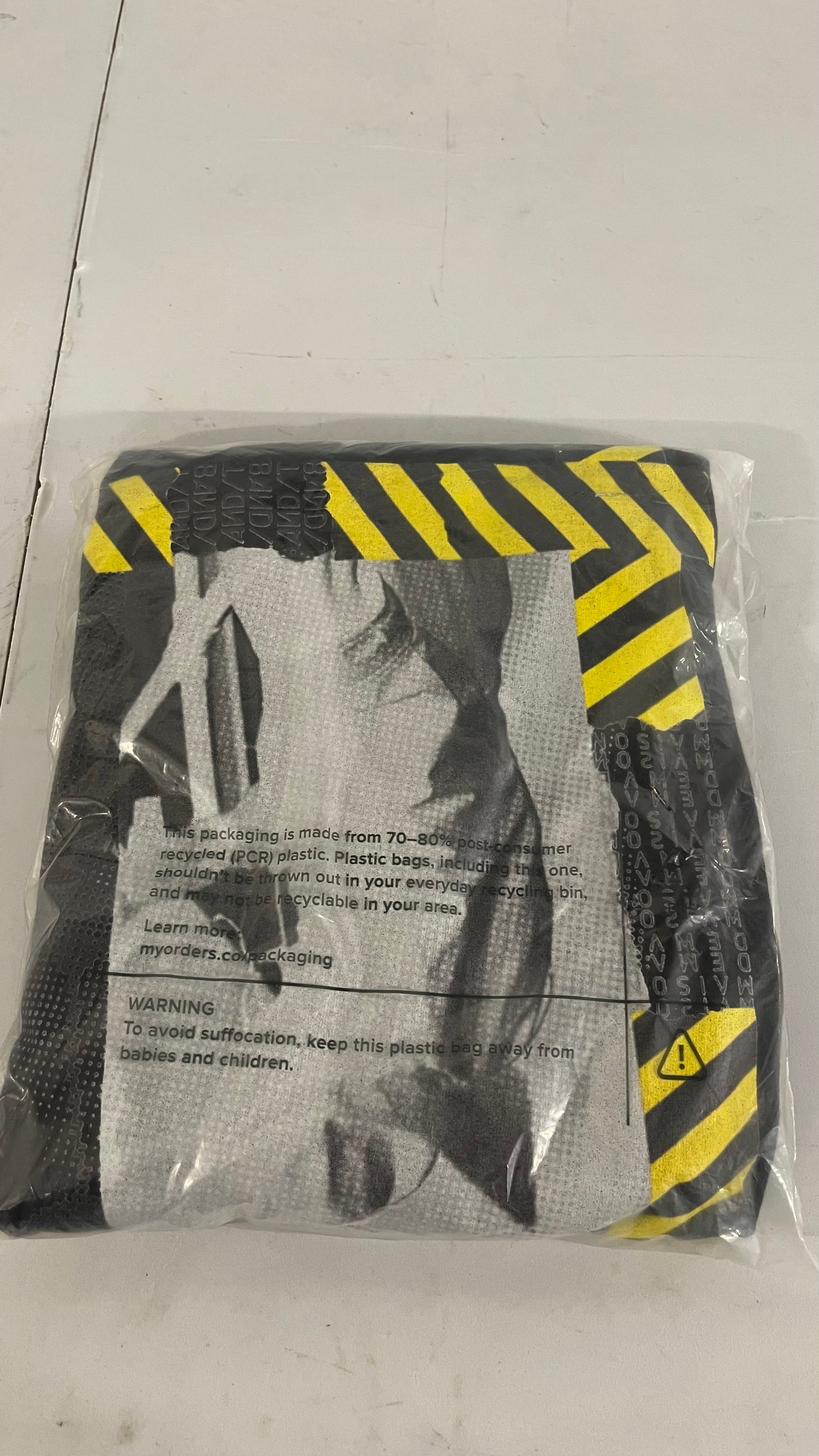 Product packaging with warning labels on a plain background