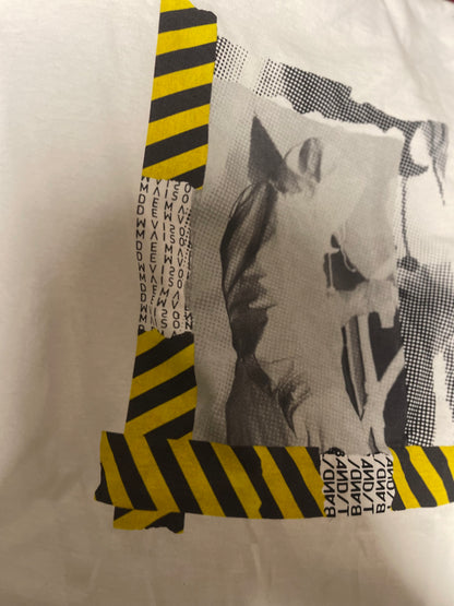 Close-up of a product with black and yellow striped border and text on a white background