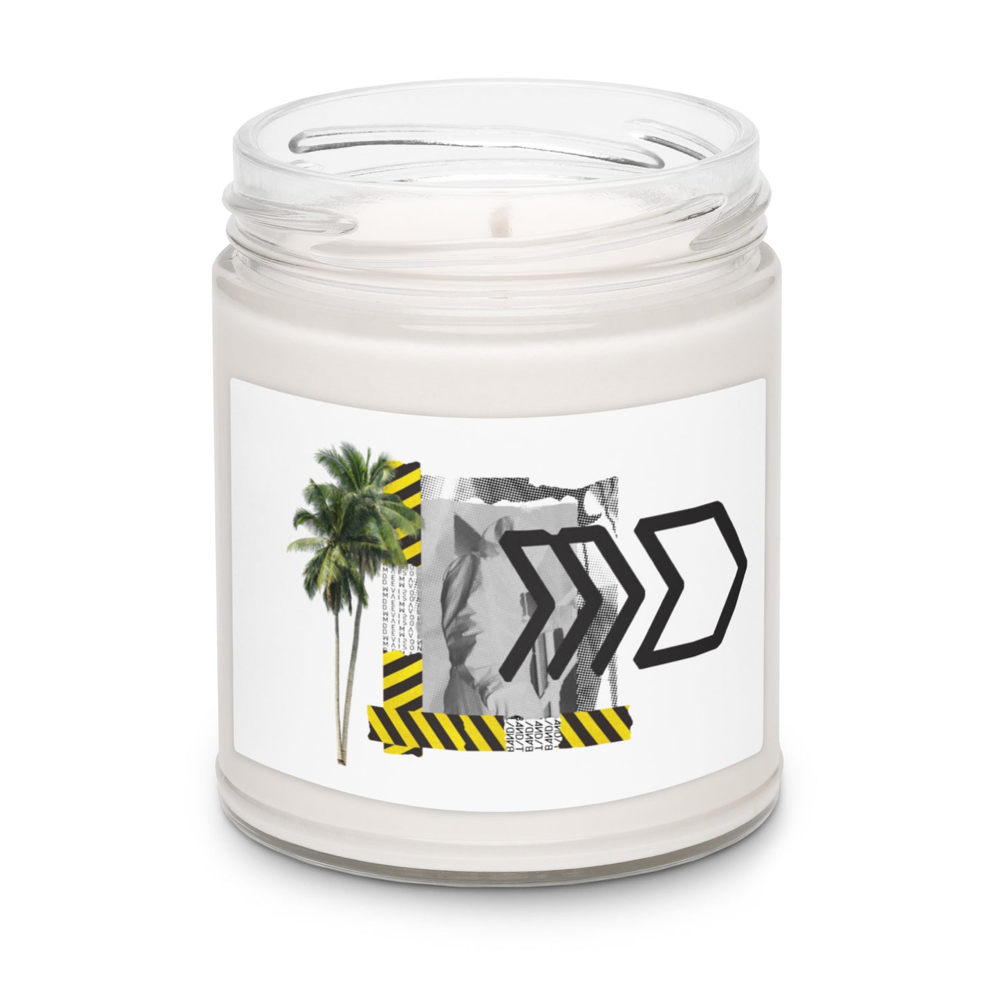 Candle in a clear jar with a label featuring palm trees and black arrows on a white background